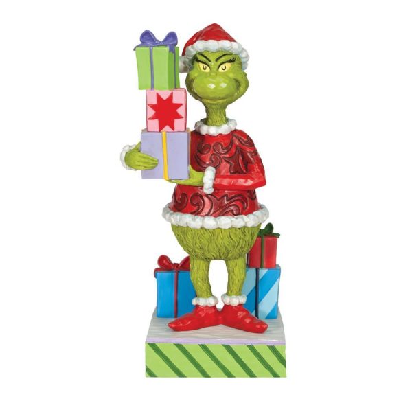 Grinch holding presents